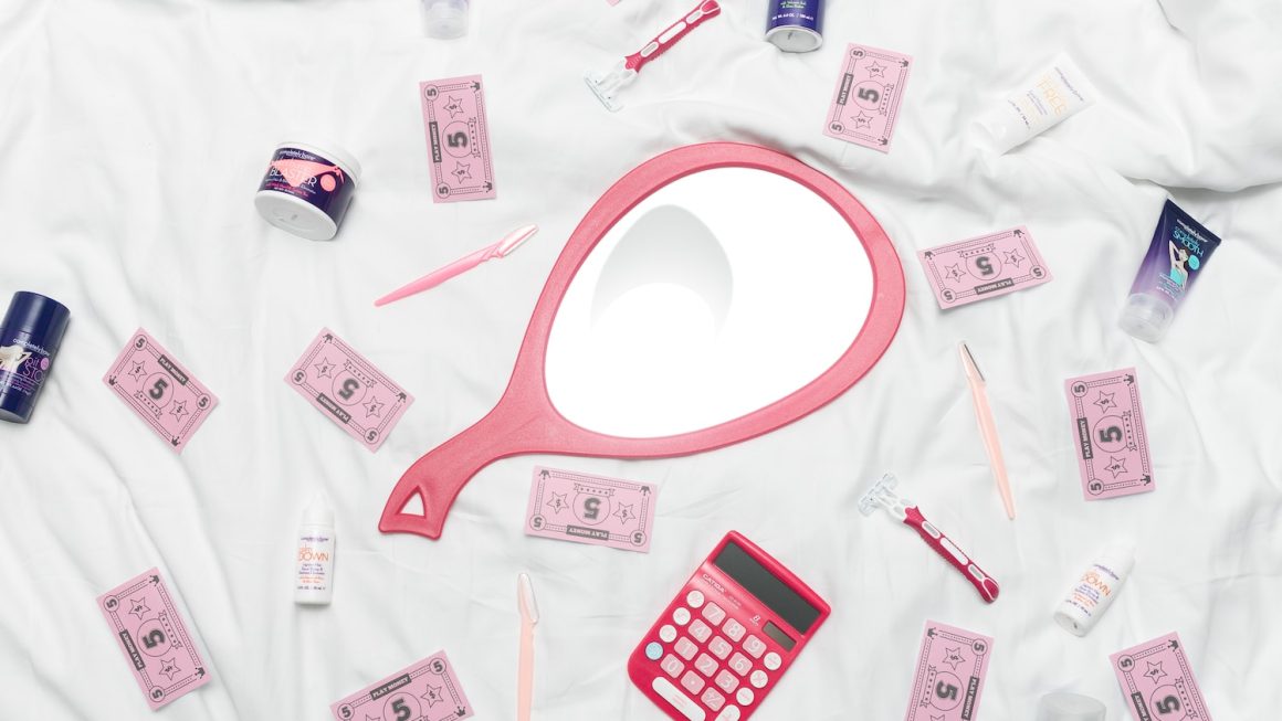 calculator, hand mirror, and toiletries in white textile